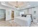 Bright main bedroom features a tray ceiling, large windows, and an ensuite bathroom at 1705 Ezra Church Nw Dr, Atlanta, GA 30314