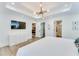 Bright main bedroom features a tray ceiling, large windows, and an ensuite bathroom at 1705 Ezra Church Nw Dr, Atlanta, GA 30314
