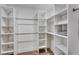 Well-organized walk-in closet with custom shelving and ample storage space at 1705 Ezra Church Nw Dr, Atlanta, GA 30314
