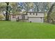 Charming house with a deck overlooking a large backyard, perfect for outdoor living and entertaining at 1971 Westley Dr, Riverdale, GA 30296