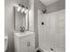 Modern bathroom boasts a stylish vanity with sleek fixtures and a walk-in shower at 1971 Westley Dr, Riverdale, GA 30296