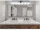 Bathroom featuring a large mirror over a dual vanity with granite countertop at 1971 Westley Dr, Riverdale, GA 30296