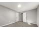 Neutral bedroom offers ample natural light, soft carpeting, gray walls, and white doors at 1971 Westley Dr, Riverdale, GA 30296
