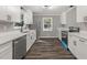 Modern kitchen with stainless steel appliances, white cabinets, and white countertops at 1971 Westley Dr, Riverdale, GA 30296