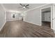 Expansive living area featuring wood-look floors, neutral walls, and seamless flow to the kitchen at 1971 Westley Dr, Riverdale, GA 30296