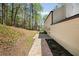 Spacious backyard with stone patio and lush landscaping at 220 Hobnail Se Ct, Marietta, GA 30067