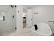 Bright bathroom with a glass-enclosed shower and a soaking tub at 220 Hobnail Se Ct, Marietta, GA 30067