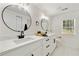 Elegant bathroom with dual sinks, modern fixtures, and ample natural light at 220 Hobnail Se Ct, Marietta, GA 30067