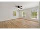 Bright bedroom with hardwood floors, a ceiling fan, and large windows at 220 Hobnail Se Ct, Marietta, GA 30067