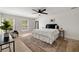 Inviting bedroom featuring hardwood floors, a ceiling fan and lots of natural light at 220 Hobnail Se Ct, Marietta, GA 30067