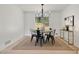 Dining area with sleek black chairs, a stylish table, and a neutral rug at 220 Hobnail Se Ct, Marietta, GA 30067