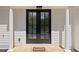 Close-up of the front door, featuring elegant columns and a welcoming 'Welcome' mat at 220 Hobnail Se Ct, Marietta, GA 30067