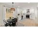 Bright kitchen featuring stainless steel appliances, white cabinets, and a cozy eat-in area at 220 Hobnail Se Ct, Marietta, GA 30067
