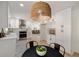 Spacious open kitchen with stainless appliances, white cabinetry, and hardwood floors at 220 Hobnail Se Ct, Marietta, GA 30067