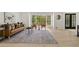 Bright living room featuring hardwood floors, a comfortable sofa, and a large window at 220 Hobnail Se Ct, Marietta, GA 30067