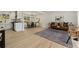 Open-concept living room with hardwood floors, modern furniture, and a seamless flow to the kitchen at 220 Hobnail Se Ct, Marietta, GA 30067