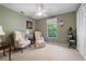 Bedroom with two comfy chairs, a window, and neutral colored walls at 3727 Cline Se Dr, Smyrna, GA 30082