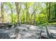 Enjoy the outdoors on this expansive wooden deck, perfect for entertaining and surrounded by lush greenery and mature trees at 3727 Cline Se Dr, Smyrna, GA 30082