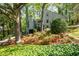 Inviting home with beautifully landscaped front yard, mature trees, and vibrant floral accents for enhanced curb appeal at 3727 Cline Se Dr, Smyrna, GA 30082