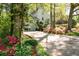 Attractive home with a well-manicured lawn and colorful flowerbeds lining the driveway, enhancing its charming curb appeal at 3727 Cline Se Dr, Smyrna, GA 30082