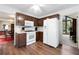 Kitchen featuring modern white appliances and wood cabinets at 3727 Cline Se Dr, Smyrna, GA 30082