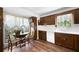 Sunlit kitchen with window, breakfast table, and wooden cabinetry at 3727 Cline Se Dr, Smyrna, GA 30082