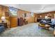 Traditional living room with wood paneling and neutral carpet at 3727 Cline Se Dr, Smyrna, GA 30082