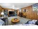 Spacious wood-paneled living room with ceiling fan and comfortable seating at 3727 Cline Se Dr, Smyrna, GA 30082