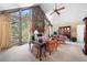 Elegant living room with stone fireplace, high ceiling, large windows, and natural light at 3727 Cline Se Dr, Smyrna, GA 30082