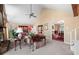Inviting living room with vaulted ceilings, stone fireplace, plush carpet, and view into dining area at 3727 Cline Se Dr, Smyrna, GA 30082