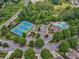 Beautiful aerial view of neighborhood amenities including pool, clubhouse, tennis courts, and playground at 626 Oakbourne Way, Woodstock, GA 30188