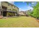 Large, fenced backyard features a deck, patio, and lush green lawn at 626 Oakbourne Way, Woodstock, GA 30188