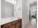 Bright bathroom with a large mirror and single sink vanity at 626 Oakbourne Way, Woodstock, GA 30188