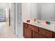 Bathroom featuring a single sink vanity with brown cabinetry at 626 Oakbourne Way, Woodstock, GA 30188