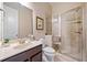 Bright bathroom with a glass-enclosed shower, vanity, and neutral finishes at 626 Oakbourne Way, Woodstock, GA 30188