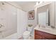 Bright bathroom featuring a shower-tub, white toilet and tile floors, and vanity at 626 Oakbourne Way, Woodstock, GA 30188