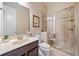 Modern bathroom featuring a glass-enclosed shower, vanity, and neutral color scheme at 626 Oakbourne Way, Woodstock, GA 30188