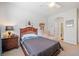 Bedroom featuring a bed, chair and decorated walls at 626 Oakbourne Way, Woodstock, GA 30188