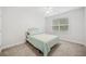 This bedroom has neutral colored walls, carpet, and a double bed with a light teal coverlet at 626 Oakbourne Way, Woodstock, GA 30188
