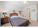 Bedroom featuring neutral tones and a decorative shelf at 626 Oakbourne Way, Woodstock, GA 30188