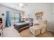 Cozy bedroom with a bed, chair, and decorated walls at 626 Oakbourne Way, Woodstock, GA 30188