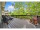 Wooden deck with outdoor seating and flower pots, offering a peaceful retreat at 626 Oakbourne Way, Woodstock, GA 30188