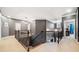Hallway with decorative railing, gray walls and carpeted floor at 626 Oakbourne Way, Woodstock, GA 30188
