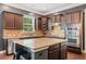 Kitchen with granite counters, stainless appliances, and ample cabinet space at 626 Oakbourne Way, Woodstock, GA 30188