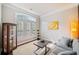 Cozy living room with a large window, modern decor, and soft, natural light at 626 Oakbourne Way, Woodstock, GA 30188