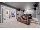 Home theater room featuring reclining seating, a large screen, and overhead projector at 626 Oakbourne Way, Woodstock, GA 30188