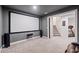 Home theater featuring a big screen and carpet at 626 Oakbourne Way, Woodstock, GA 30188