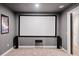 Home theater featuring a big screen, carpet, and speaker system at 626 Oakbourne Way, Woodstock, GA 30188