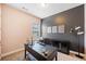 Office space with modern decor, desk, chair, and natural light from window at 626 Oakbourne Way, Woodstock, GA 30188