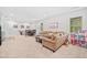A spacious recreation area features a sofa, table, billiards, and cabinets at 626 Oakbourne Way, Woodstock, GA 30188